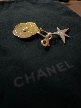 CHANEL Gold & Silver tone metal Camillia & Star Charm. 2025 Holiday Celestial